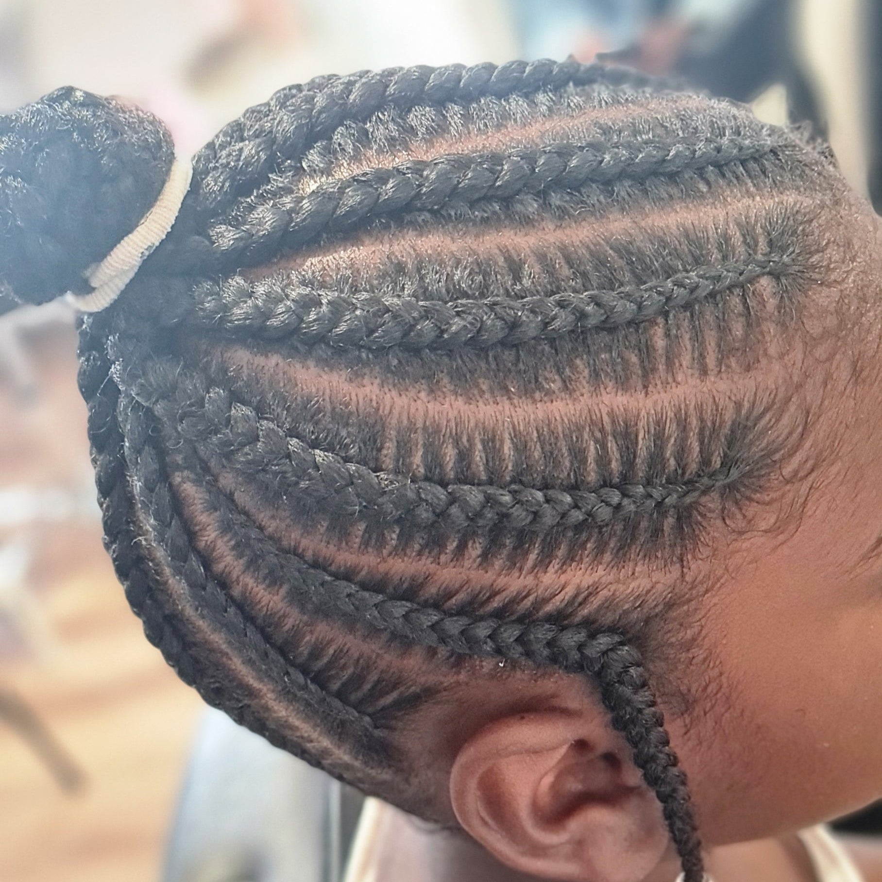 tresses collées en chignon avec cheveux naturels